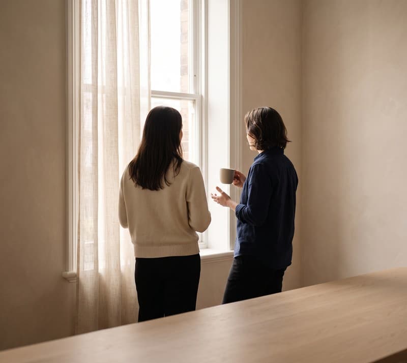 Colleagues in conversation at the studio